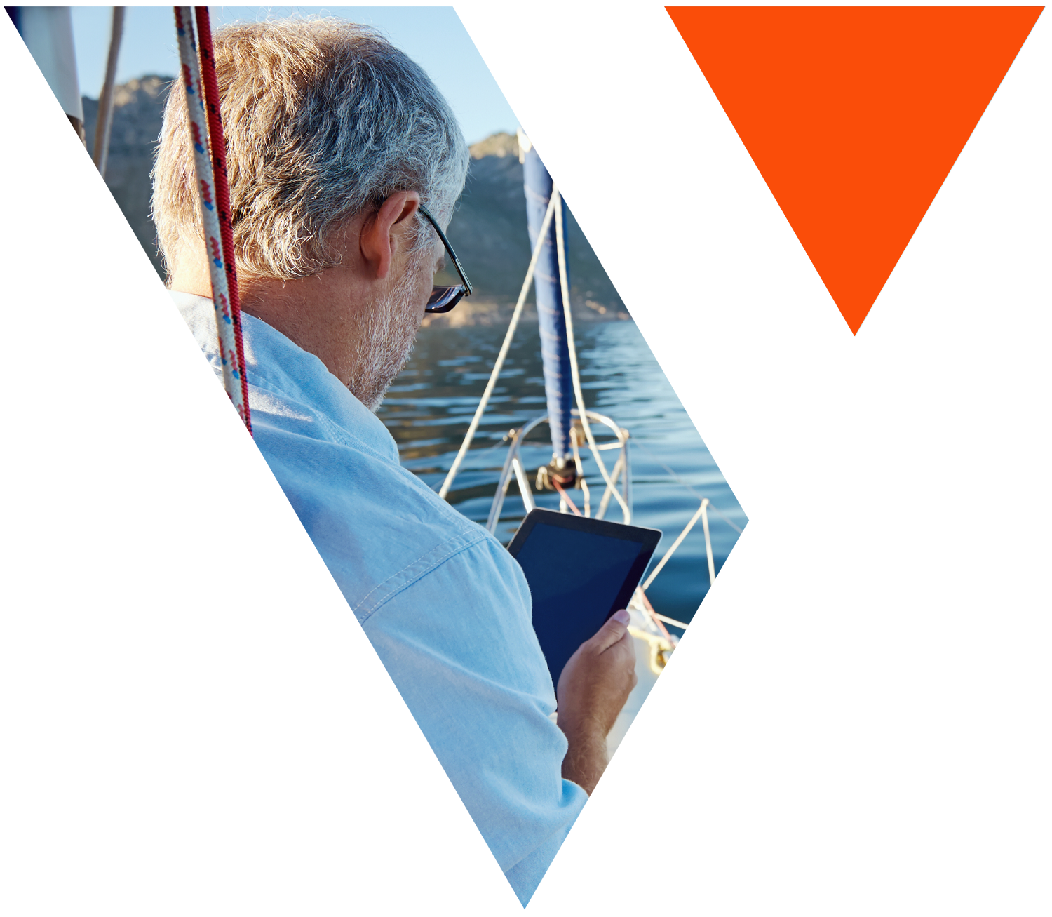 Person looks at tablet on a boat in image shaped like the Vision Financial Group logo