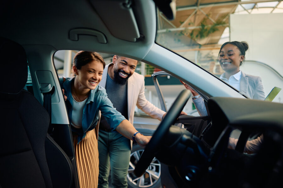 Man and woman buying or leasing a car
